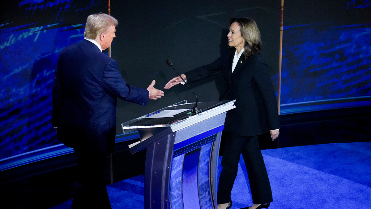 Trump and Harris shaking hands at debate