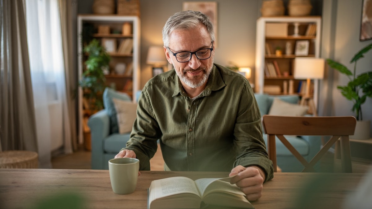 Older man reading book