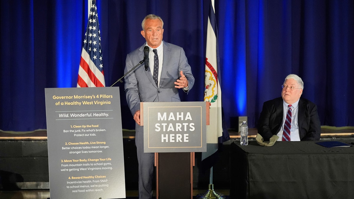 Health and Human Services Secretary Robert F. Kennedy Jr., left, speaks during a news conference with West Virginia Gov. Patrick Morrisey.