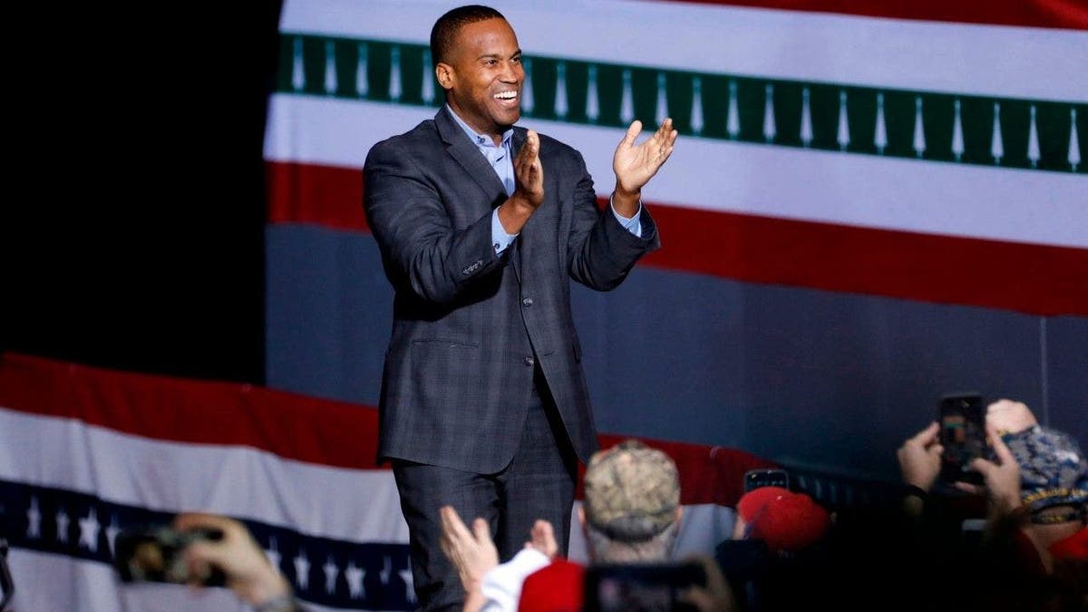 Rep John James speaks at a rally