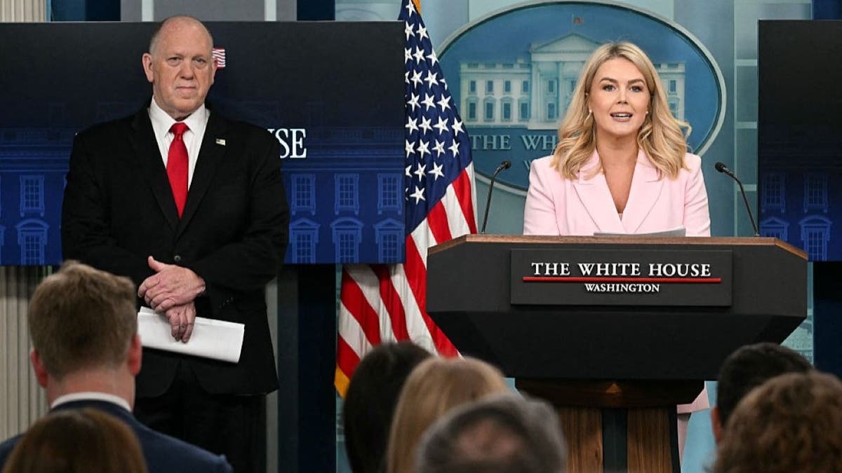 White House Press Secretary Karoline Leavitt speaks as White House 'border czar' Tom Homan looks on during the daily briefing in the Brady Briefing Room of the White House in Washington, DC, on April 28, 2025. US President Donald Trump is to name and shame cities accused of "obstructing" his crackdown on illegal immigration, the White House said Monday, in a move aimed at "protecting American communities from criminal aliens." (Photo by Jim WATSON / AFP) (Photo by JIM WATSON/AFP via Getty Images)