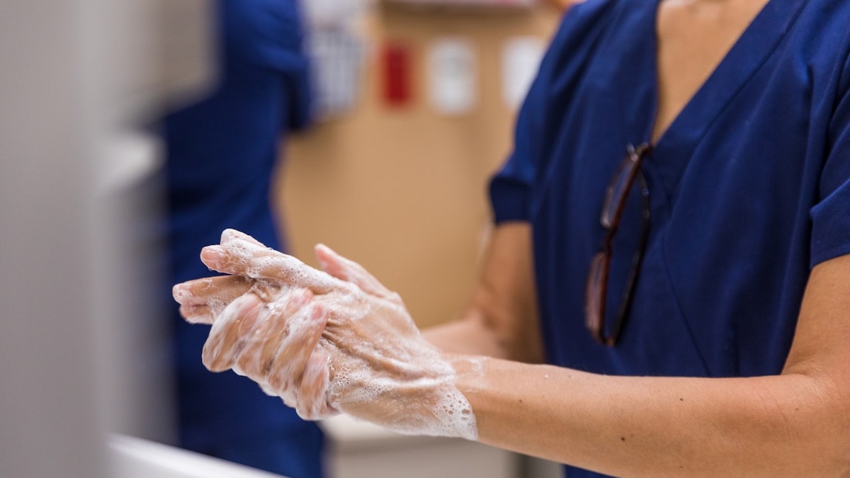 Doctor scrubbing out