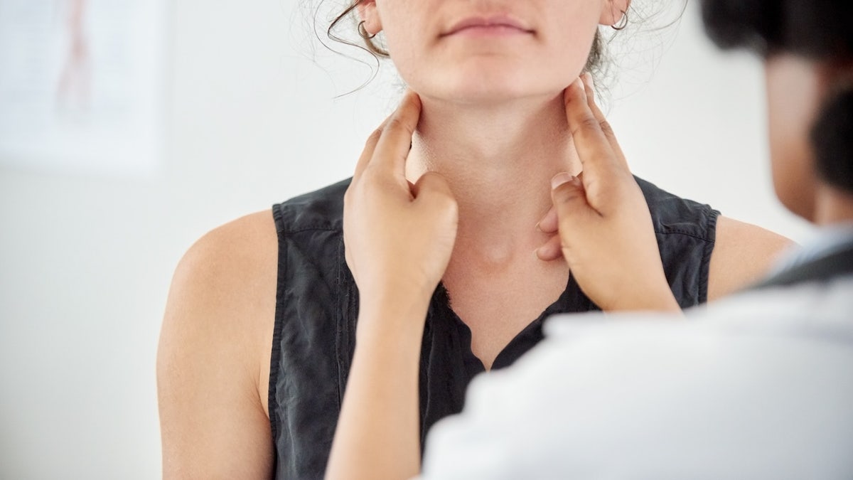 Woman throat exam