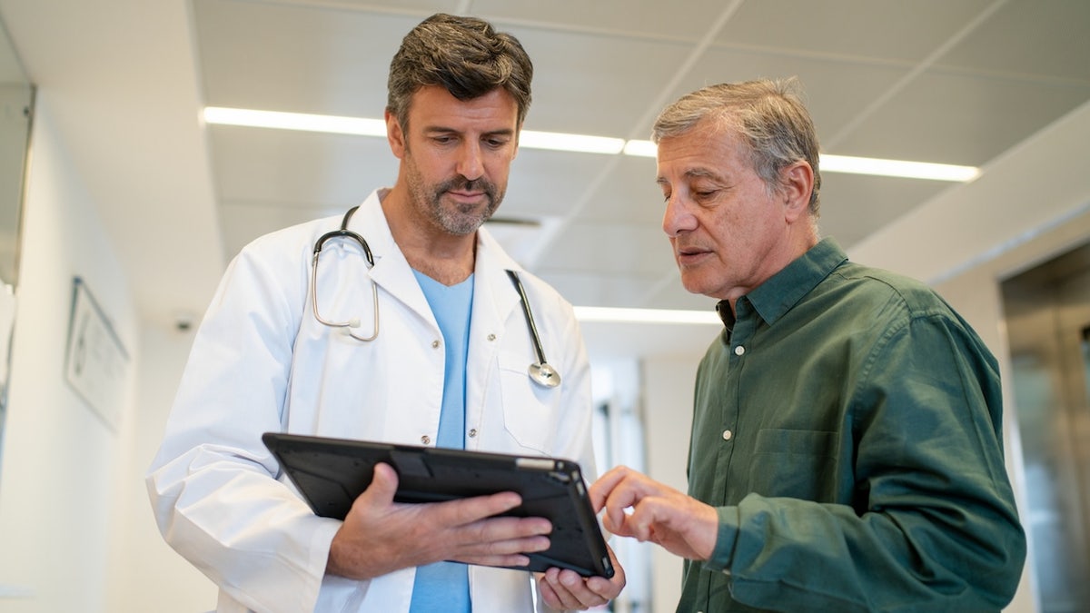 Man talking to doctor