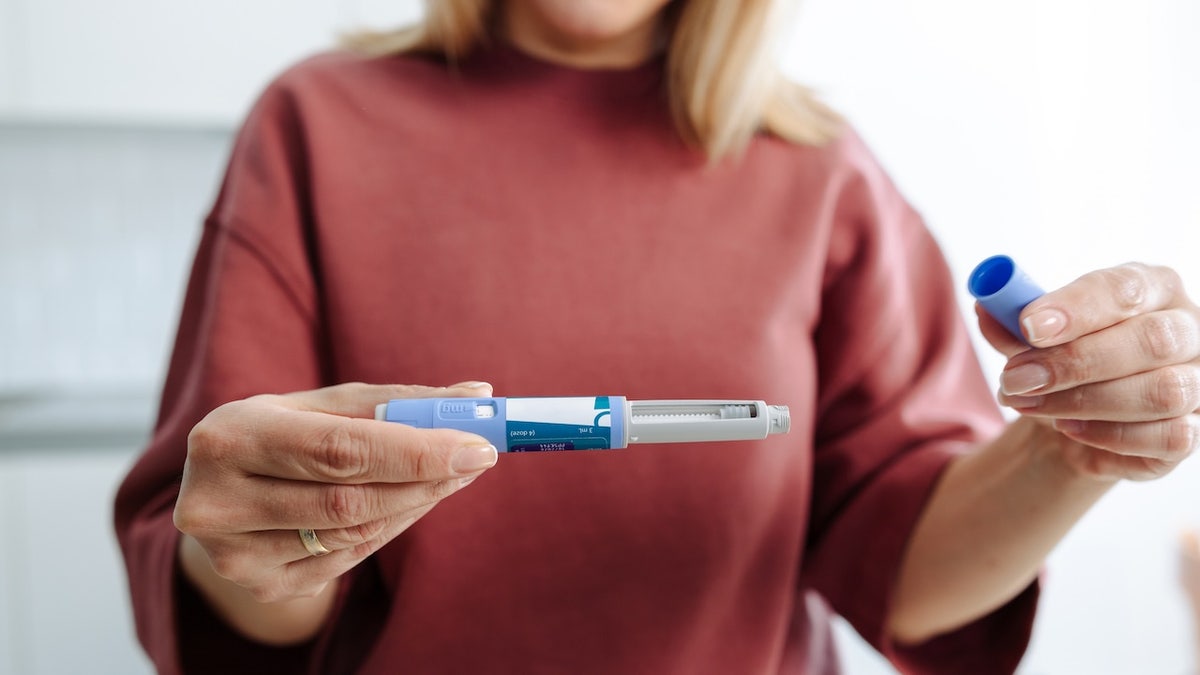 Woman holding injectable