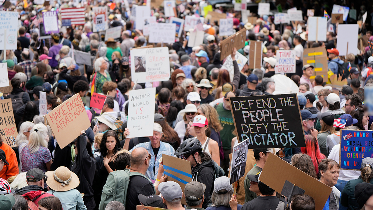 Demonstrators take part in the "No Kings" protest, Saturday, June 14, 2025, in Portland, Ore.