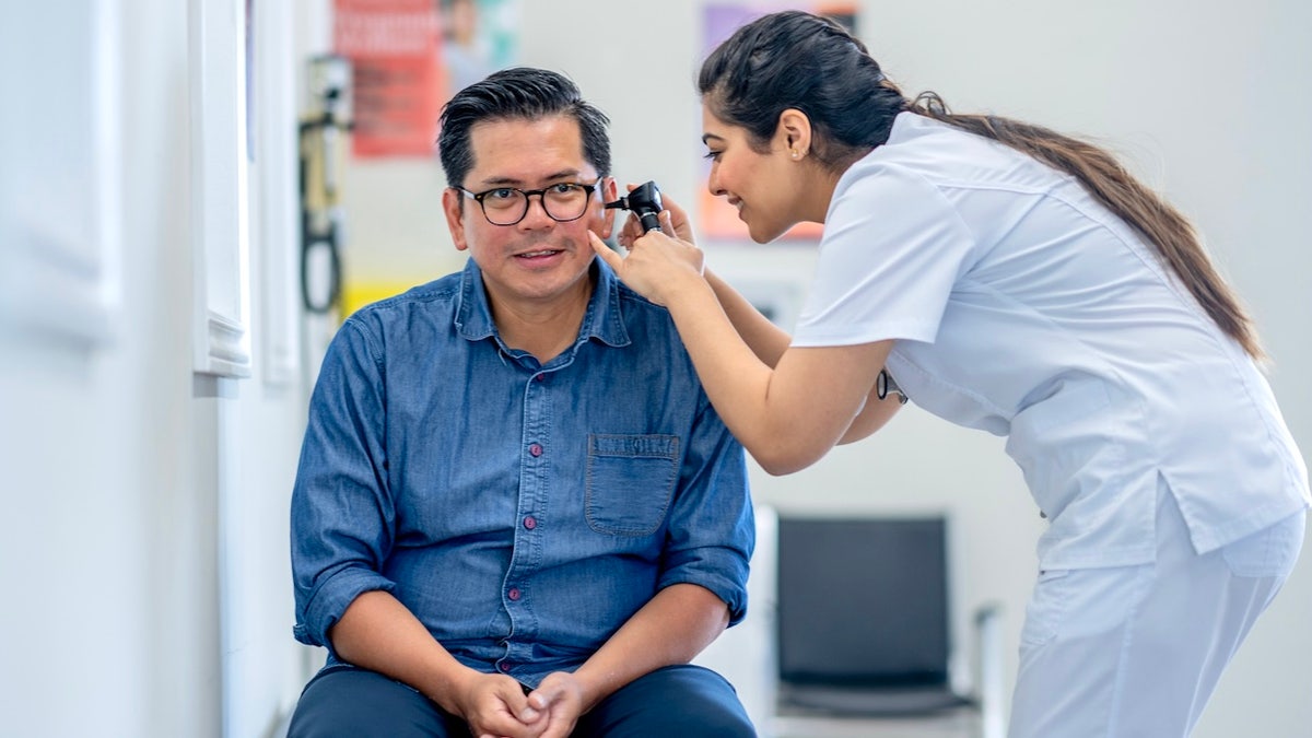 Man at ear doctor