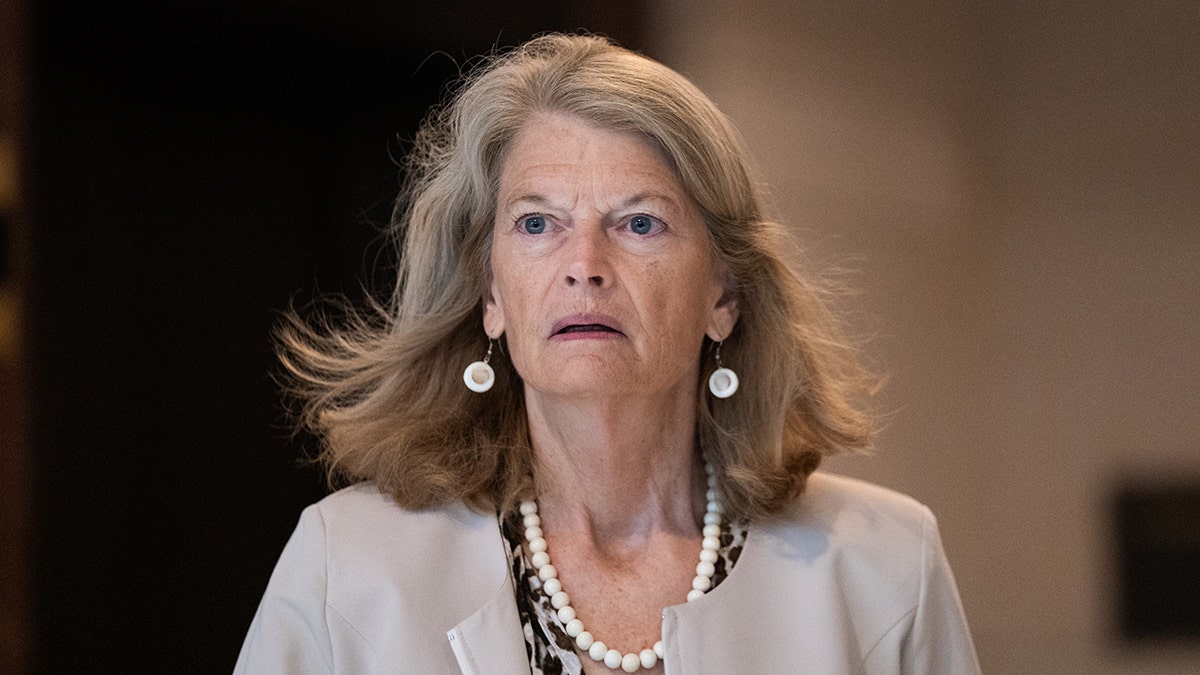 Murkowski arrives at a subcommittee hearing on defense