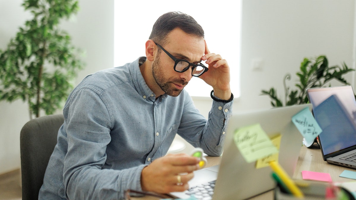 Business man performing time management strategies