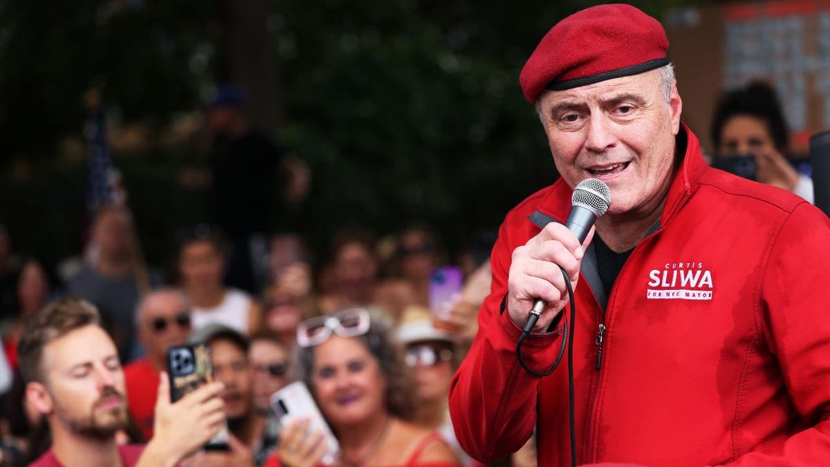 Curtis Sliwa speaking into microphone