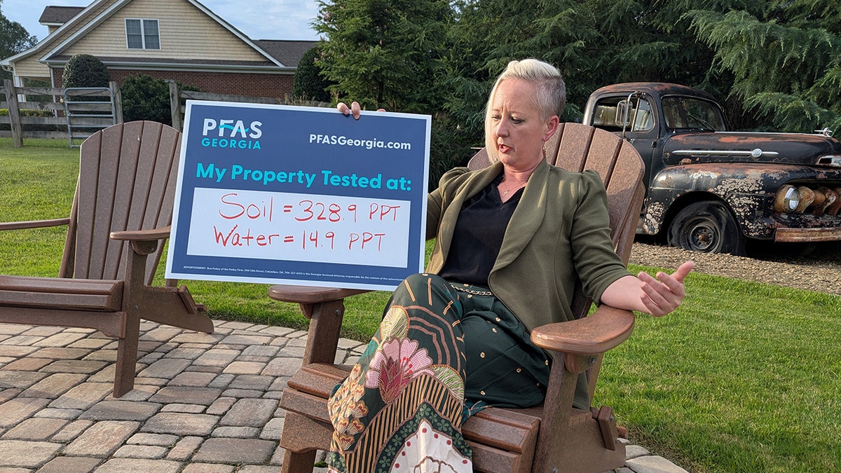 Woman in GA holds up PFAS results