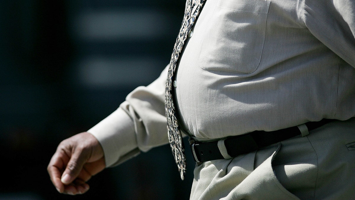 Zoomed in picture of a man's stomach from 2005