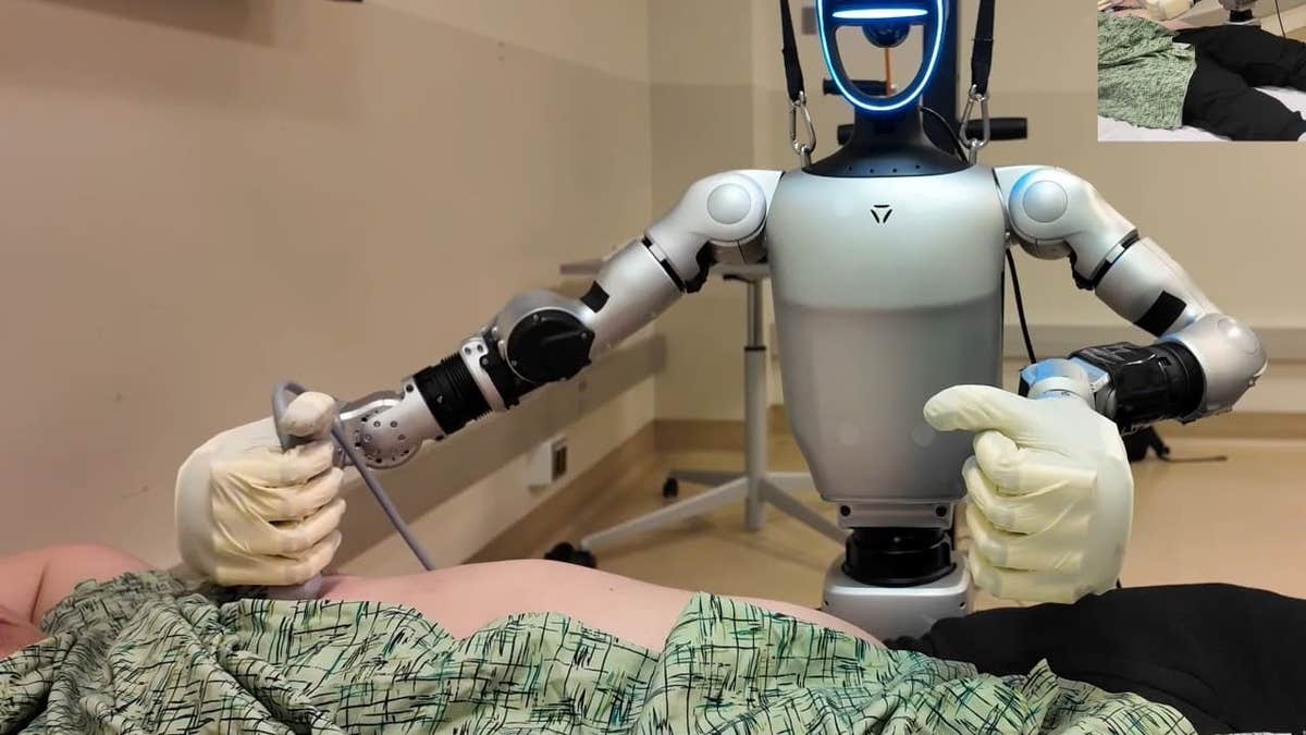 The Unitree G1 humanoid robot performing an ultrasound.