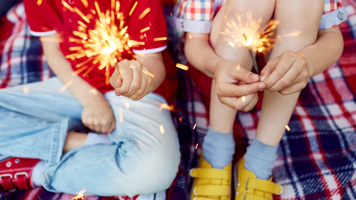 Children holding sparklers