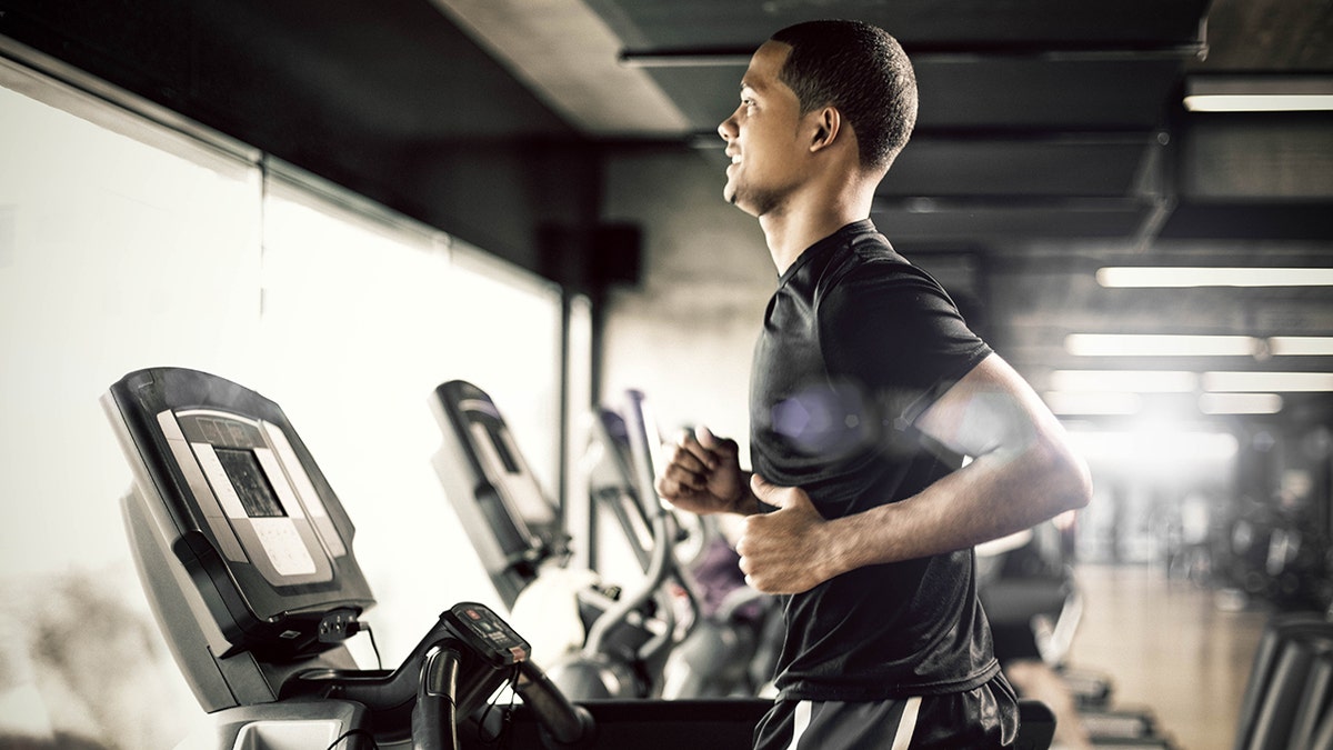 man running on treadmill