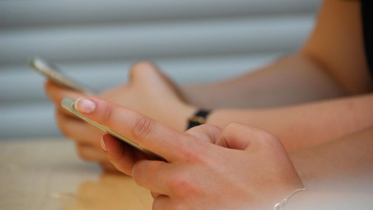 An image of people on their smartphones.