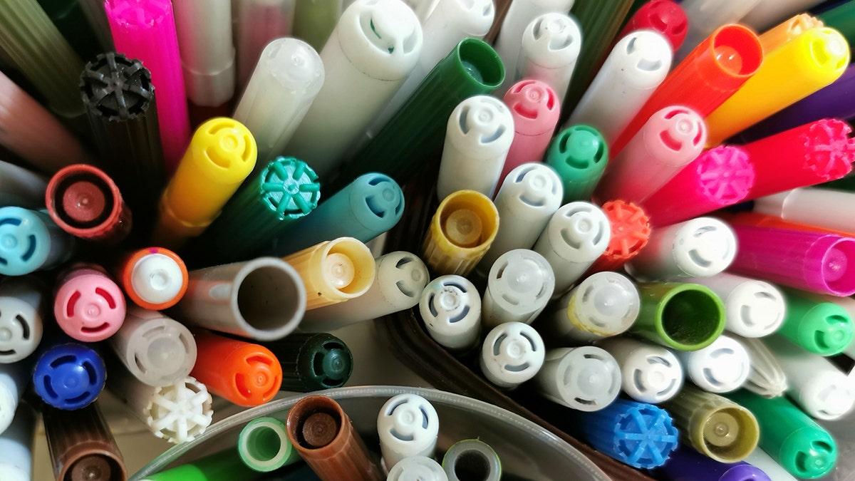 Colorful permanent marker caps view from top