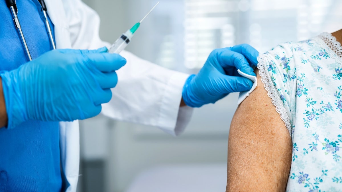 Older woman getting vaccine