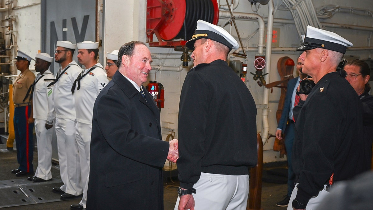 Secretary Phelan meets Navy officers aboard ship