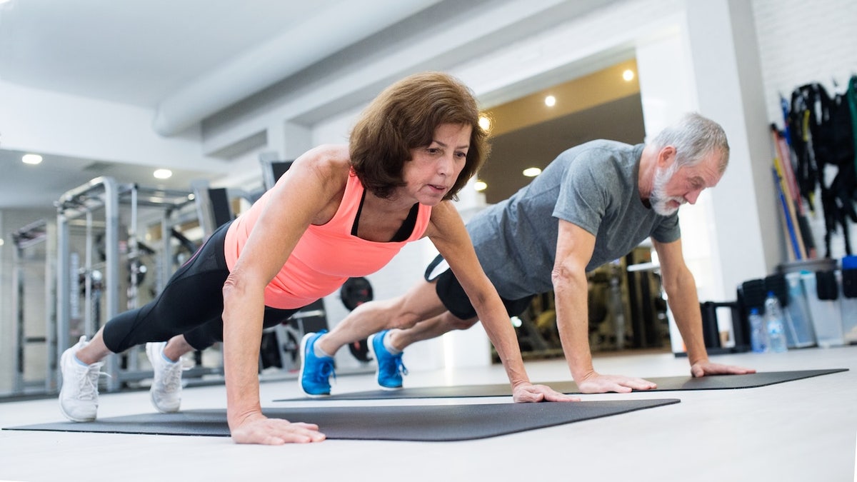 Older couple doing push-ups