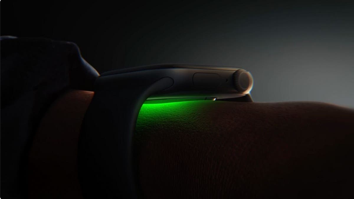 Close-up of Apple Watch sensor glowing green