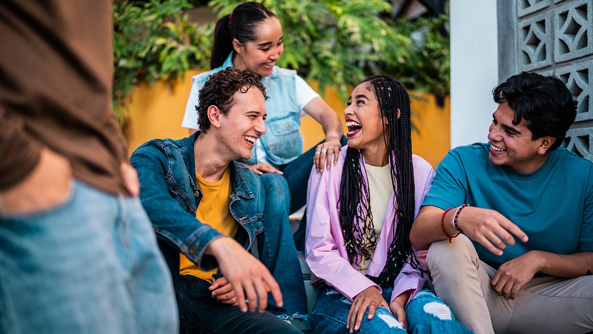 Young friends talking outdoors