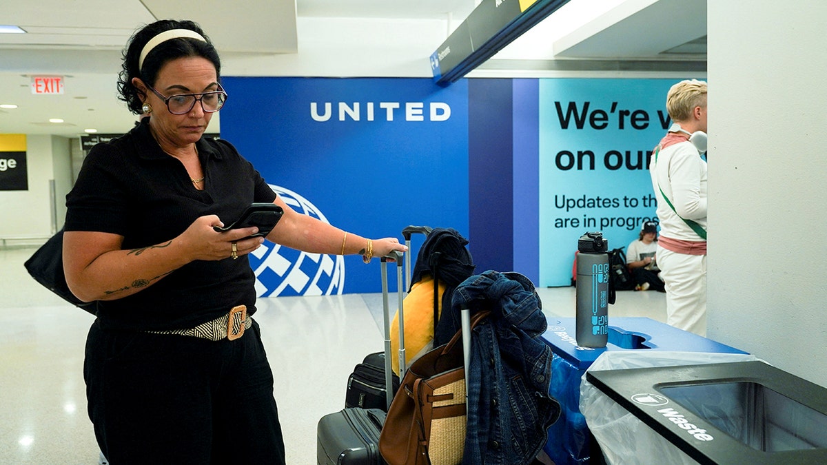 Newark, New Jersey airport passenger on phone