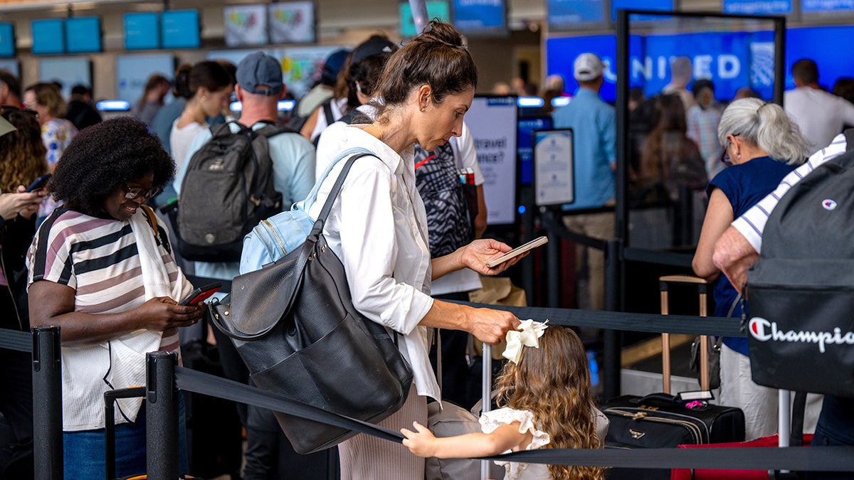 Austin, Texas airport passenger checks phone