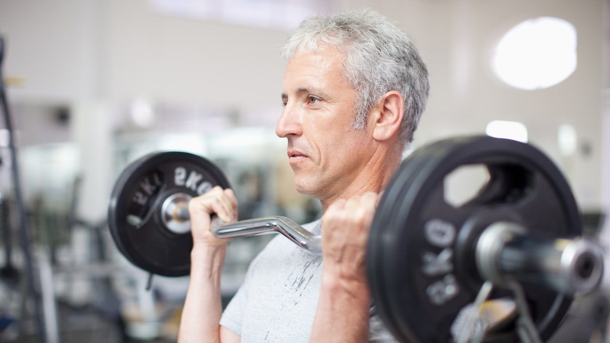 Older man lifting weights