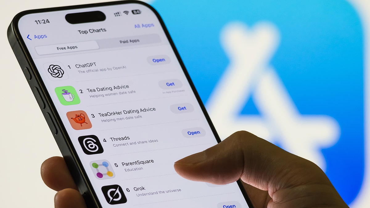 Woman scrolling through apps.