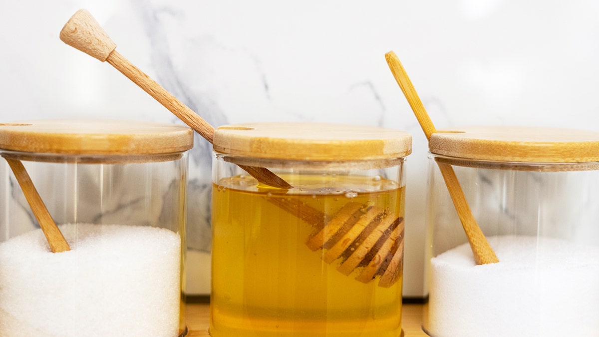 Jars with sugar, honey and salt