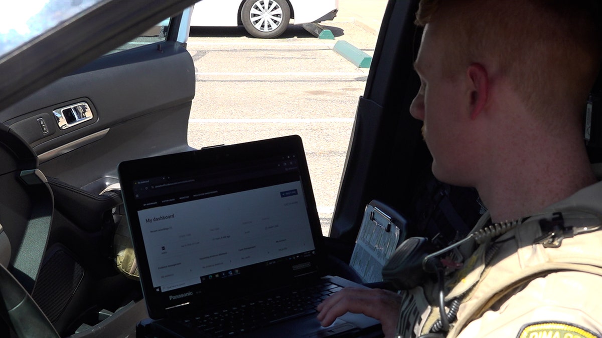 Pima County deputy enters information into Draft One