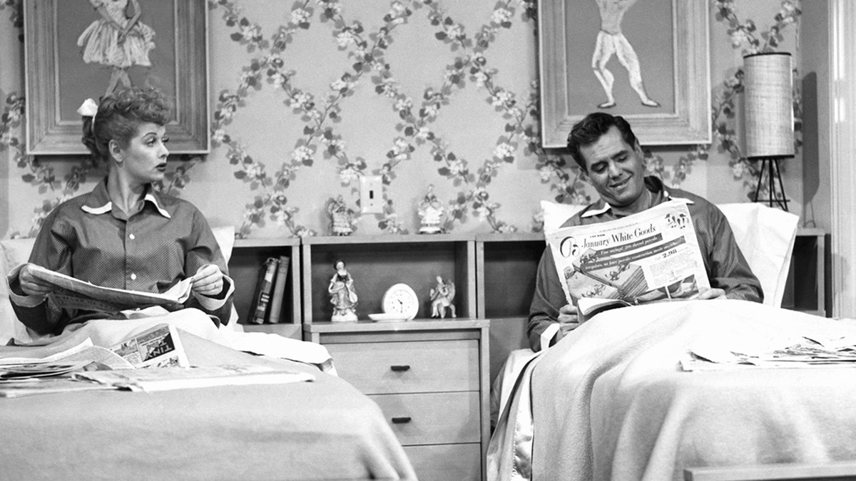 lucile ball, desi arnaz on set of I Love Lucy in separate beds
