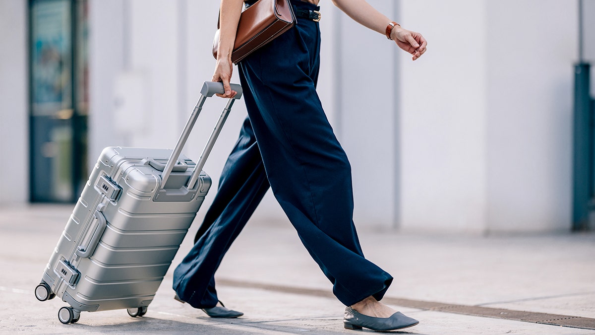 Woman with suitcase in airport