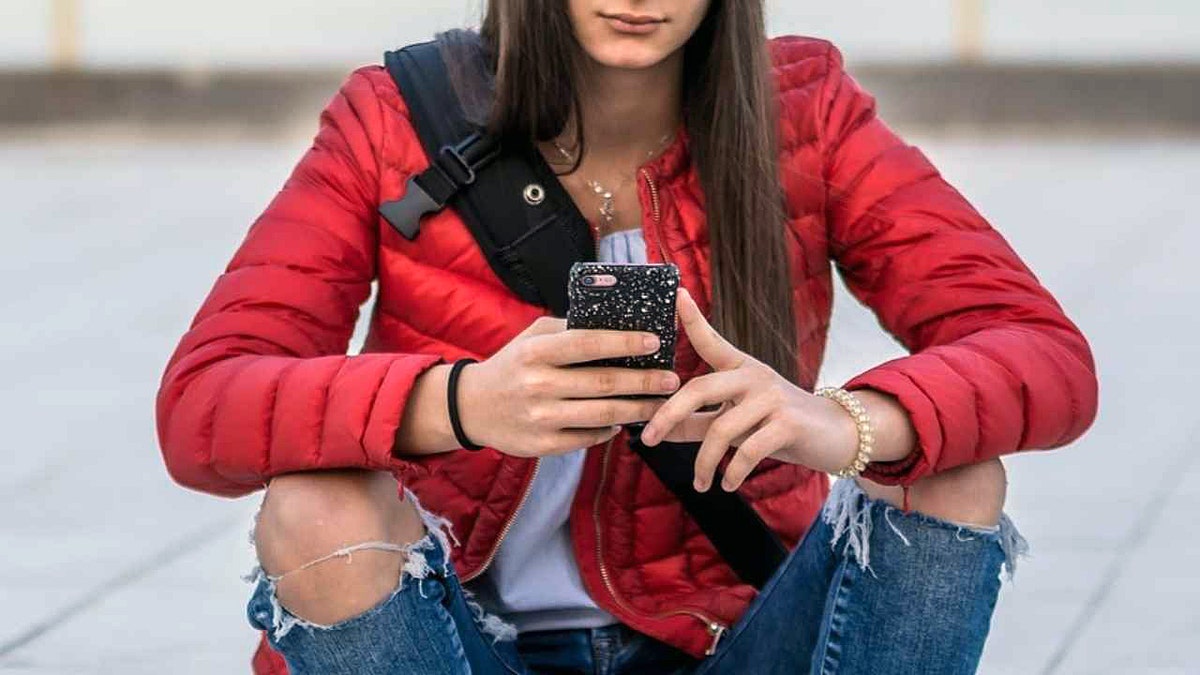 A girl uses her phone
