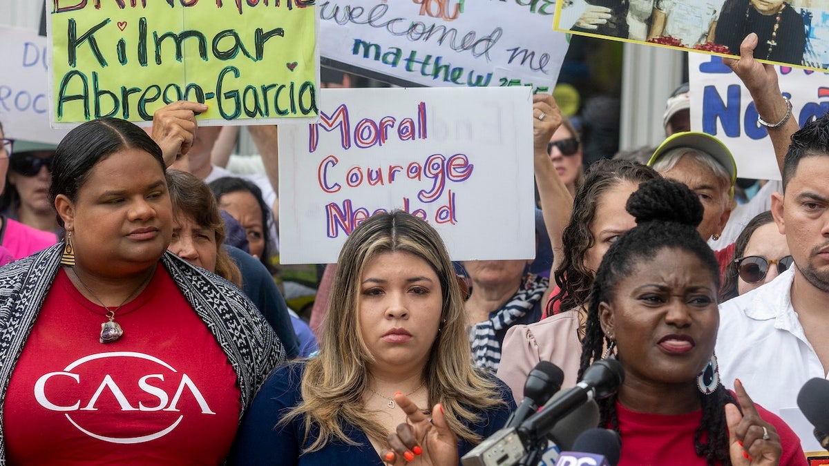 The wife of Kilmar Abrego Garcia, Jennifer Vasquez Sura, stands with demonstrators as they rally in support of Garcia outside federal court during a hearing in Greenbelt, Maryland. (Jim Watson/AFP via Getty)