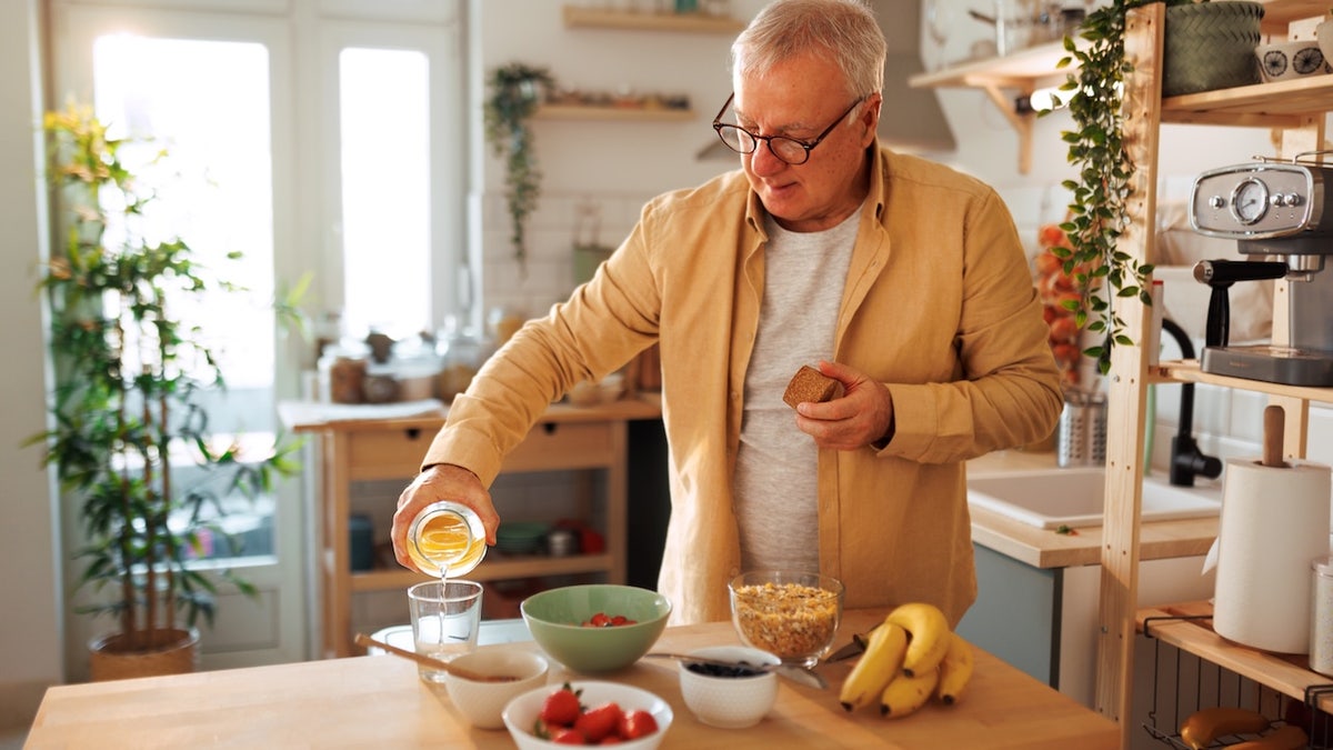 Older man making healthy breakfast