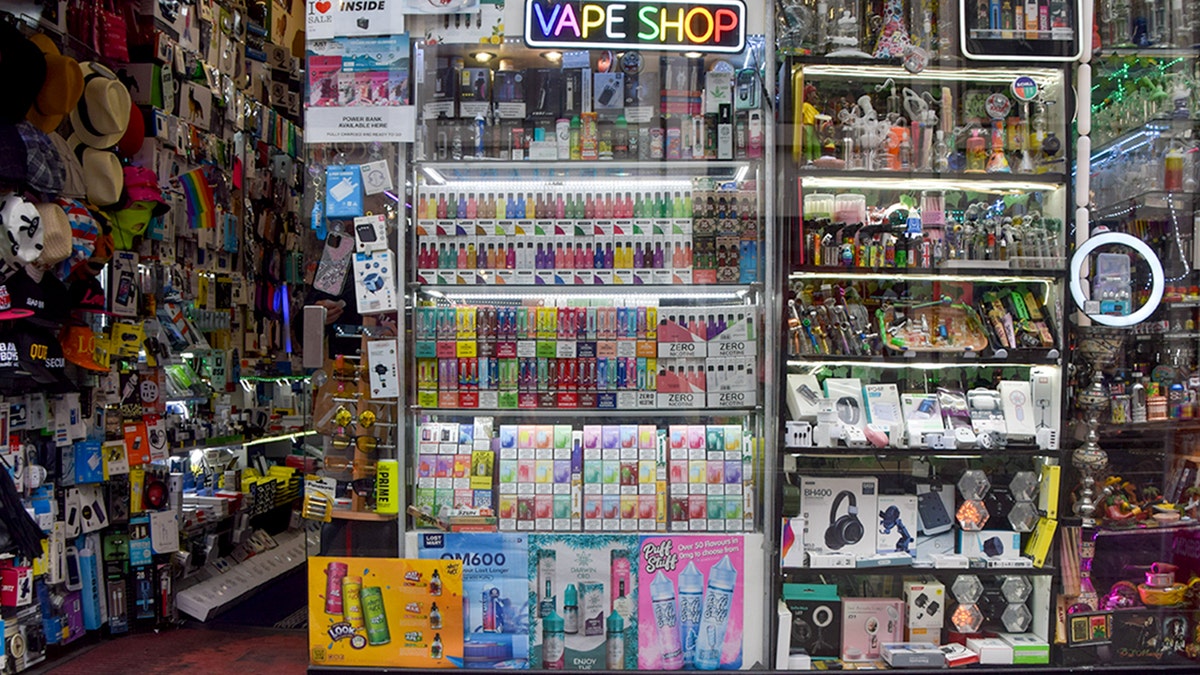 Vape shop storefront displaying colorful products