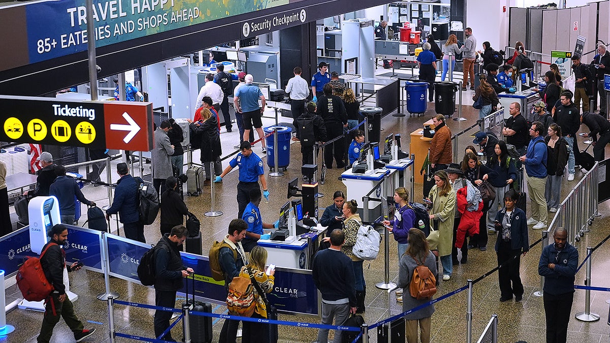 Travelers go through TSA airport security at Seattle-Tacoma International Airport, Thursday, Nov. 6, 2025, in SeaTac, Wash., during the government shutdown.