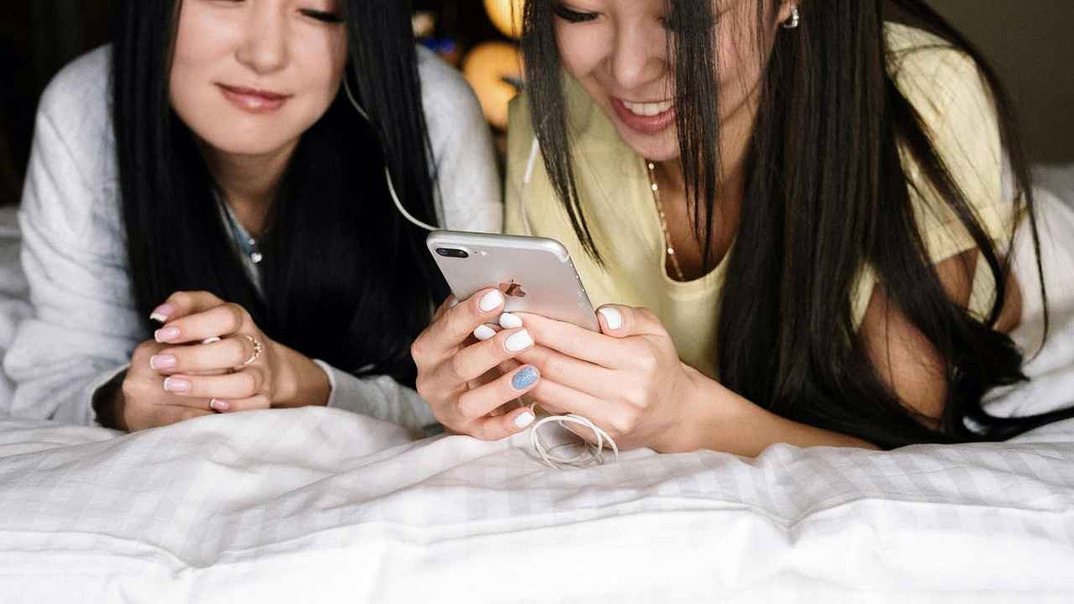 Two women listening to music