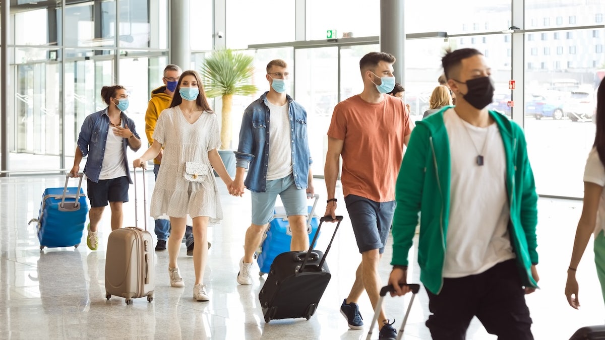 Crowd at airport - measles outbreak - contagion
