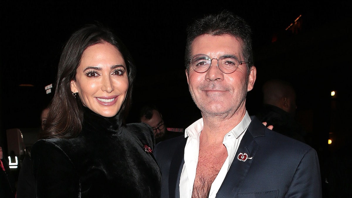 Simon Cowell with wife