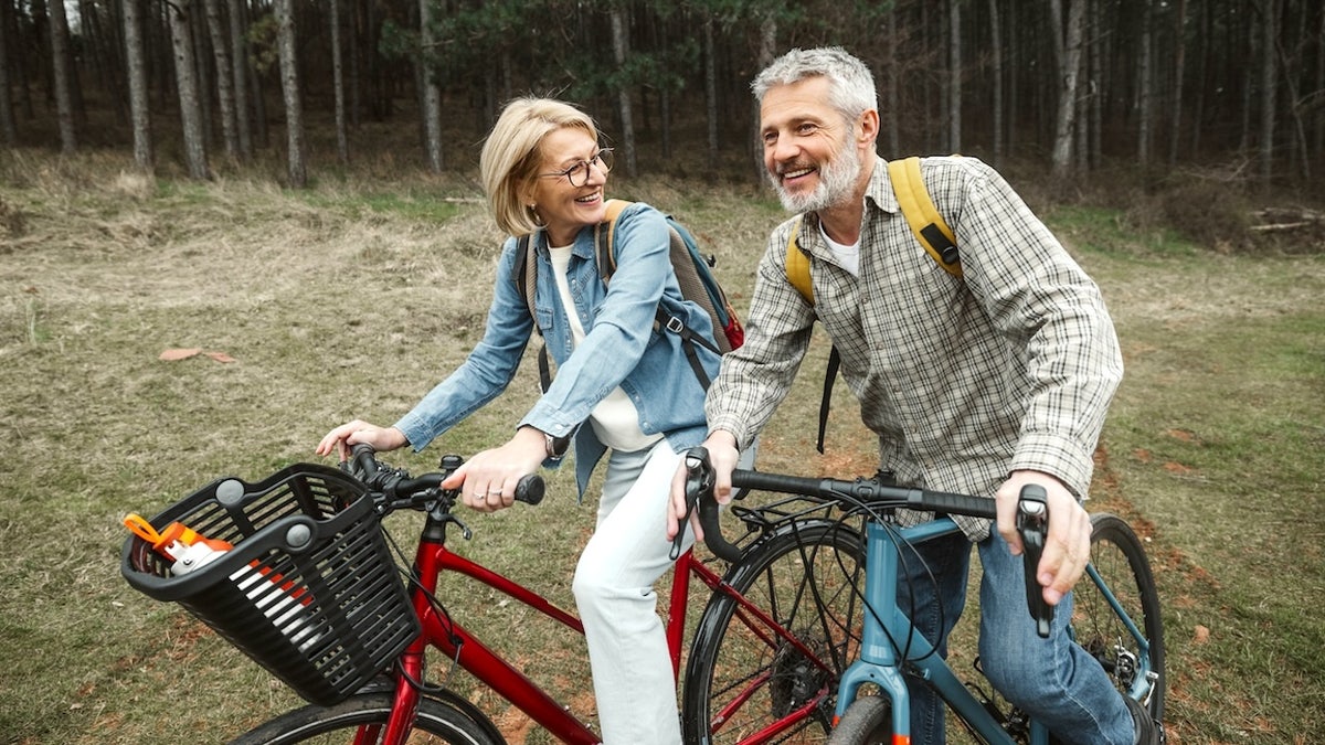 Mature couple riding bikes