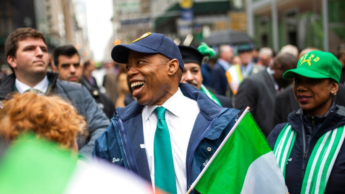New York Mayor Eric Adams, center smiles as he marches up Fifth Avenue during the St. Patrick's Day Parade, Thursday, March 17, 2022, in New York. St. Patrick's Day parades across the nation, including the largest in New York City, resume after a pandemic-driven hiatus. Back in 2020, the parades were among the first major events to get cancelled in the U.S. in what quickly became a cascade of shutdowns. This year, New York's parade coincides with the city's reopening, with mask and vaccination rules recently lifted.