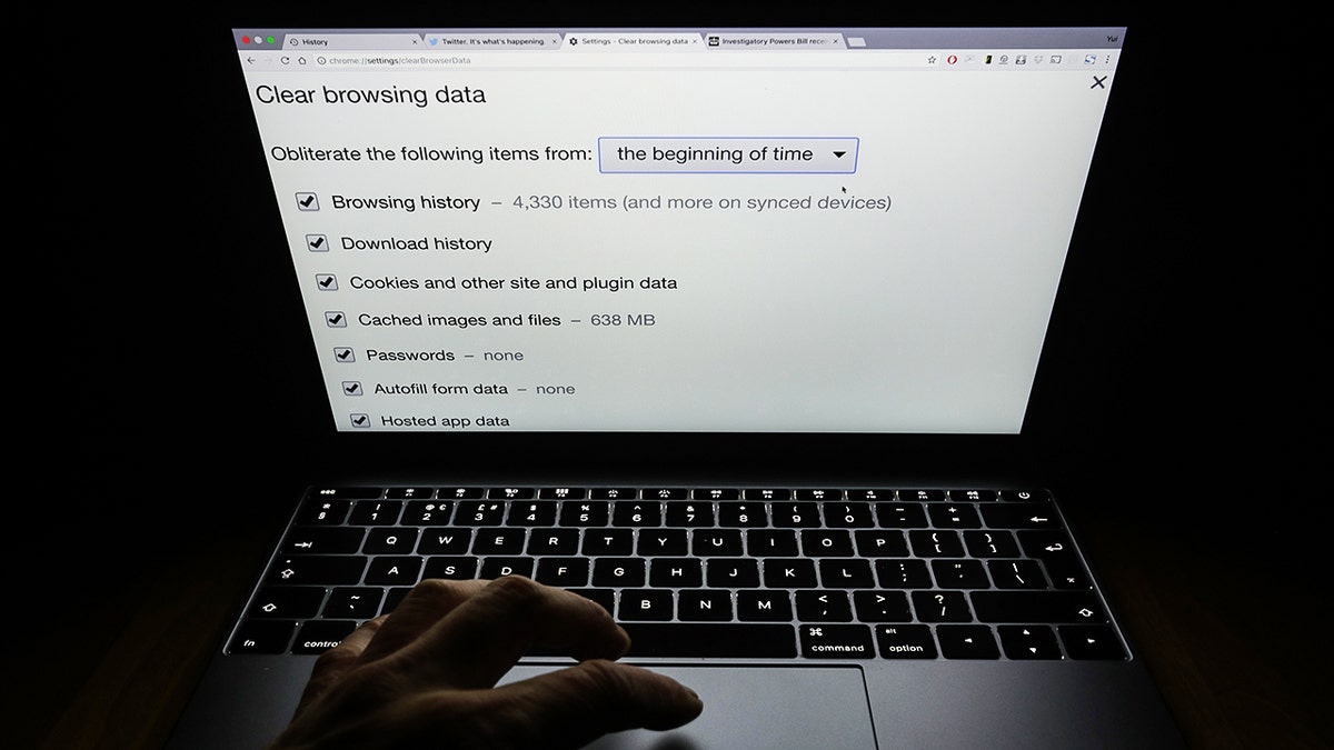A person typing on their computer.