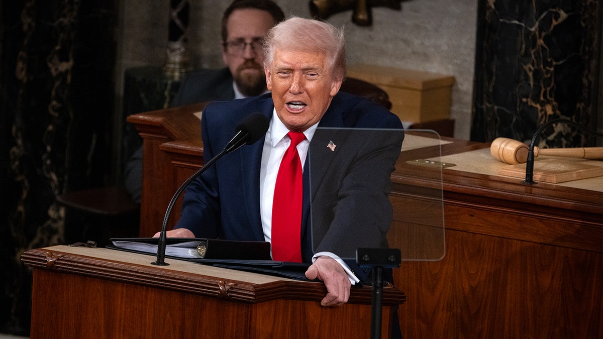 President Donald Trump speaks at a podium in the United States Capitol.