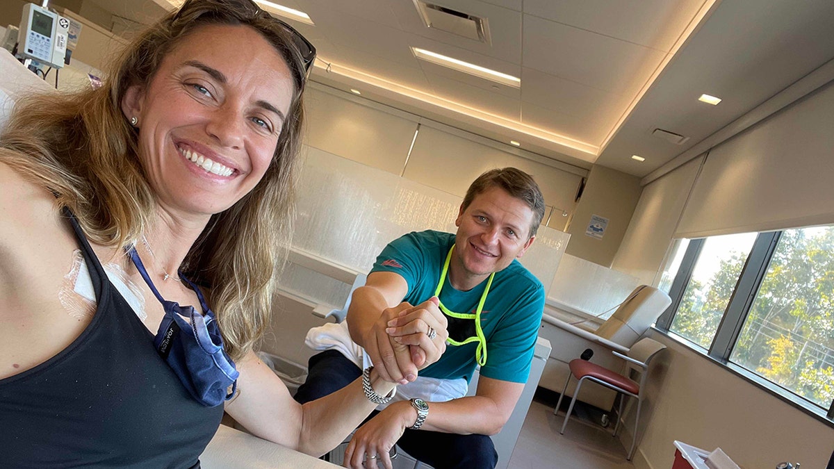 marisa peters holds husband's hand during treatment