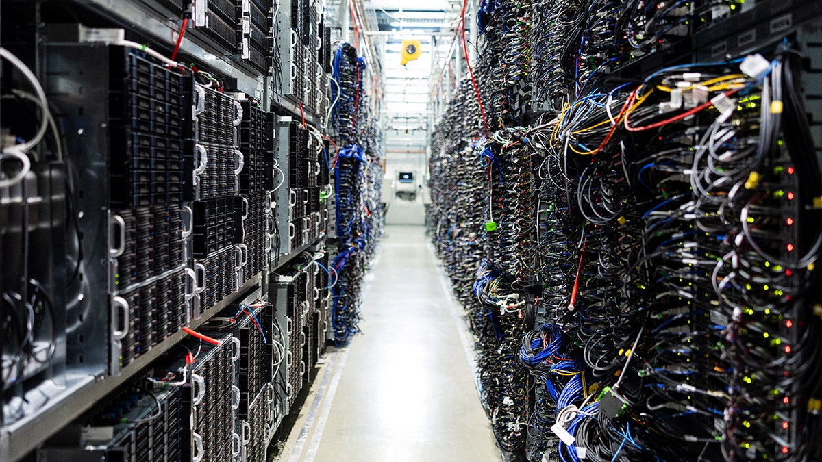 Racks of servers with colorful wires in a data center