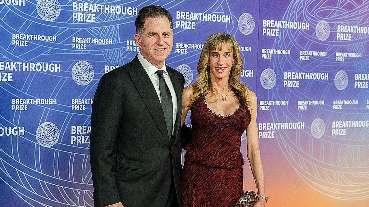 Michael Dell and Susan Dell pose on the red carpet at the Breakthrough Prize event