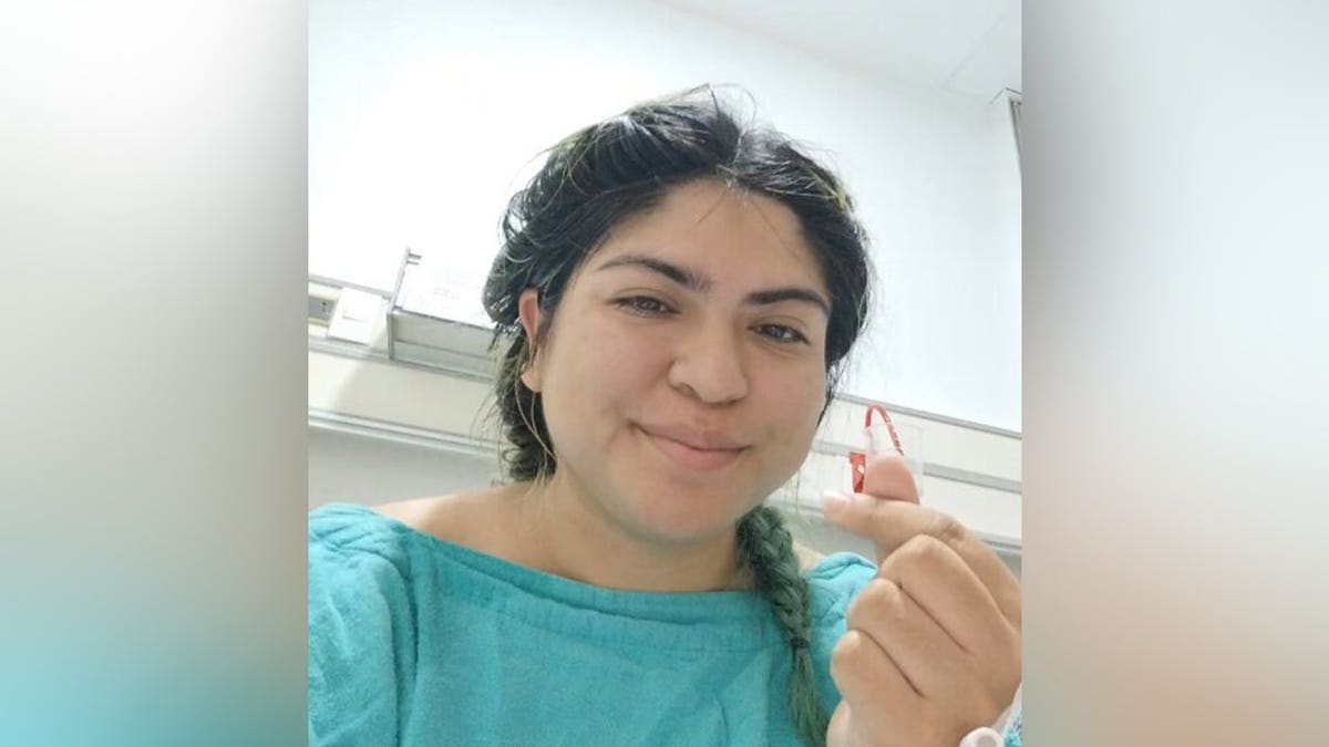 Monica Deyanira Cabrera Barajas wearing a hospital gown on the day of surgery